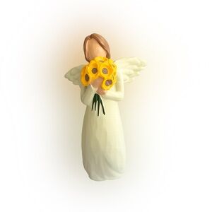 Angel Figurine Holding Yellow Flower Bouquet